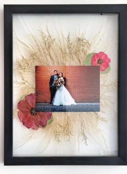 Natalie's framed composition with her wedding photo and pressed flowers